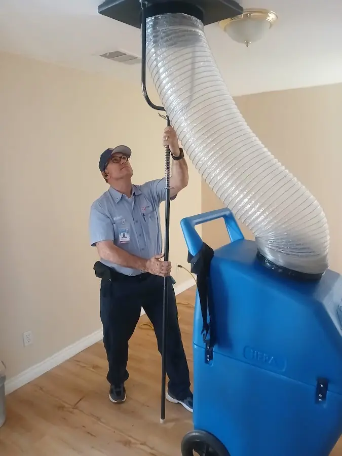 HVAC Installation technician using HEPA equipment in Red Oak